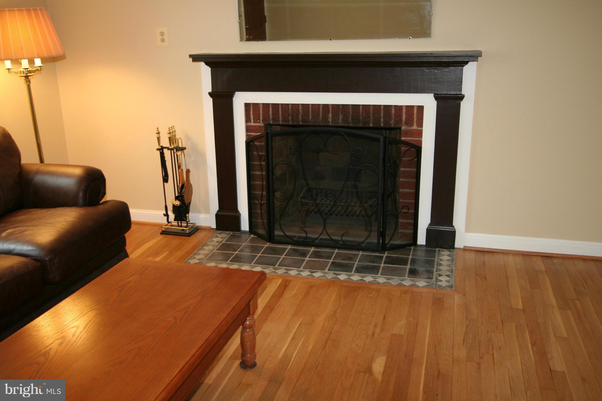 10514 Inwood Avenue Silver Spring, MD 20902 - Photo 10 of 30 Living Room Fireplace with Beautiful Tile Work