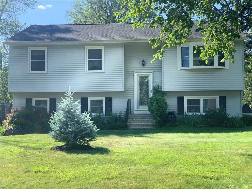 18 Mohawk Road Plainville, CT 06062 - Photo 1 of 1 a house that has a yard in front of it