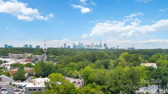an aerial view of a house with swimming pool garden and patio