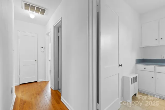 a view of kitchen and wooden floor