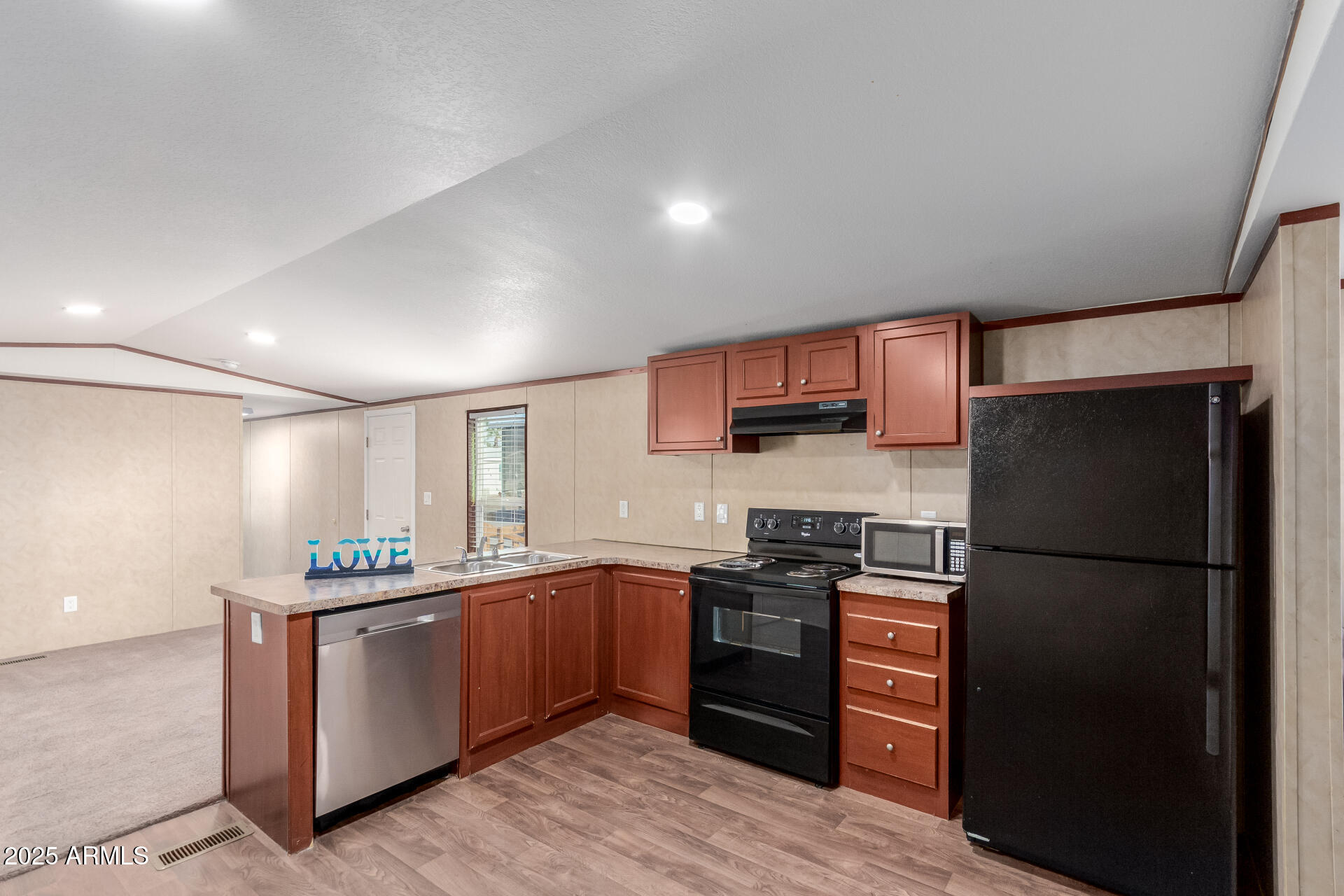 2000 South Apache Road, Unit 395 Buckeye, AZ 85326 - Photo 11 of 36 a kitchen with stainless steel appliances granite countertop a refrigerator and a stove top oven