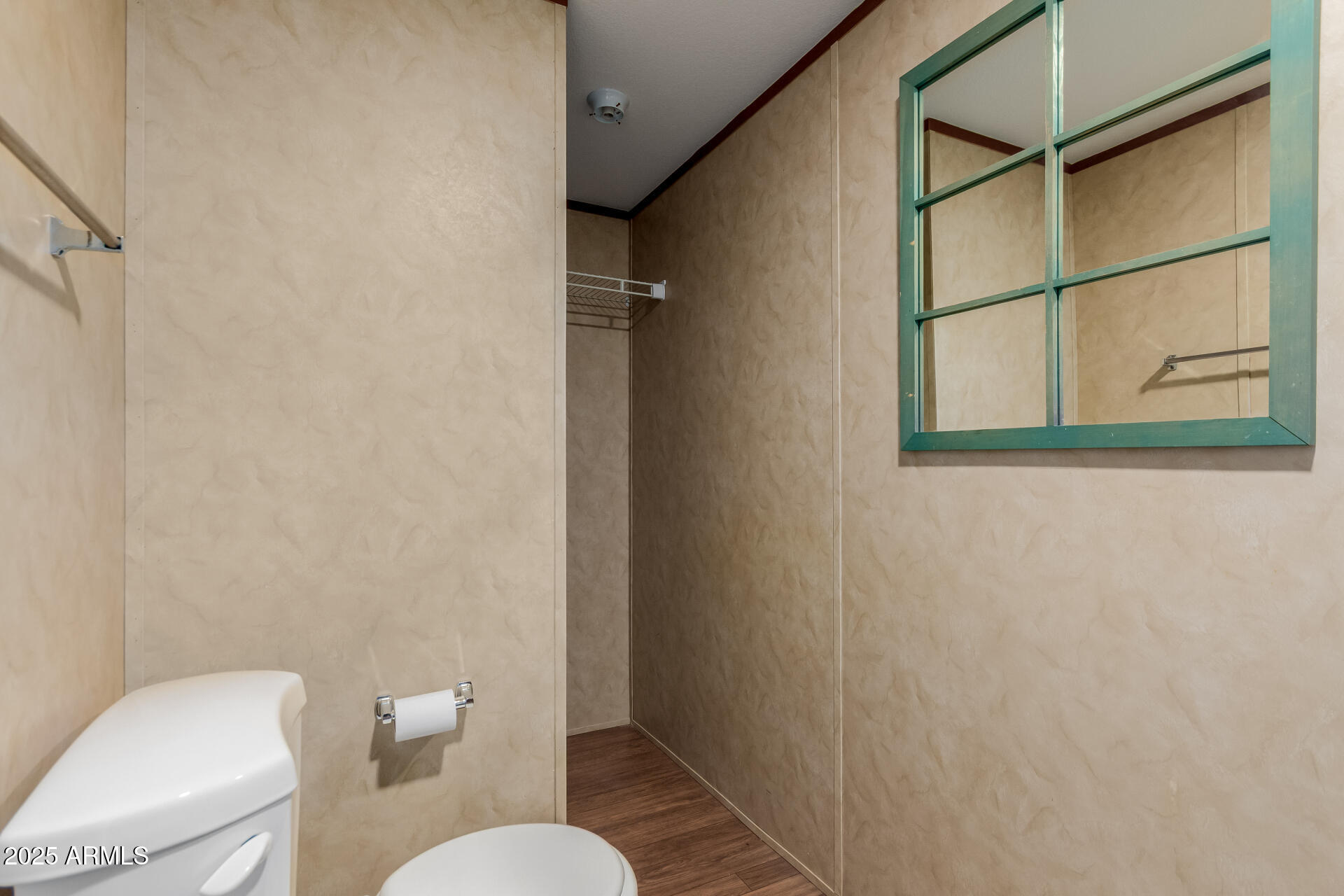 2000 South Apache Road, Unit 395 Buckeye, AZ 85326 - Photo 16 of 36 a white toilet sitting next to a small bathroom