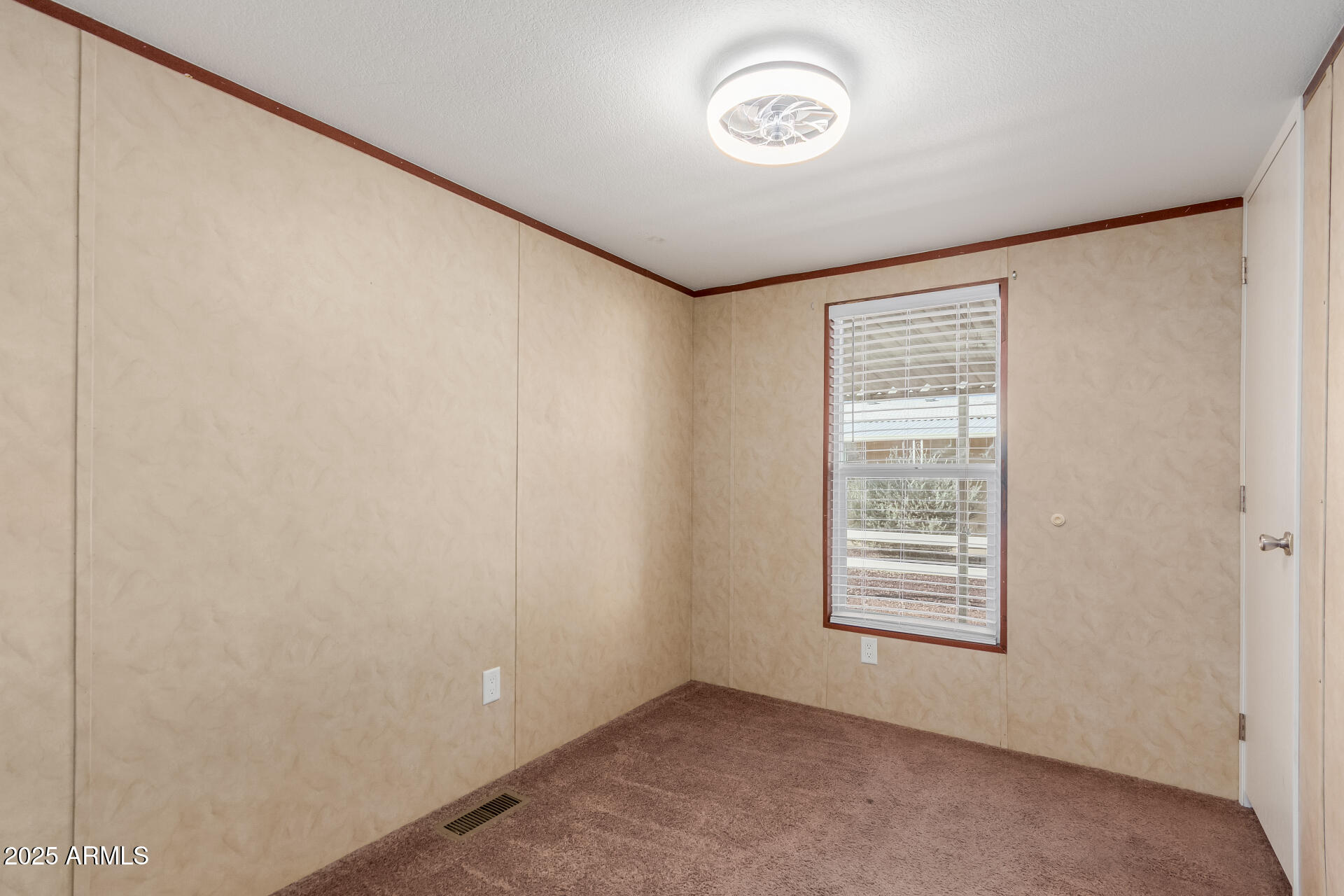2000 South Apache Road, Unit 395 Buckeye, AZ 85326 - Photo 20 of 36 an empty room with a window