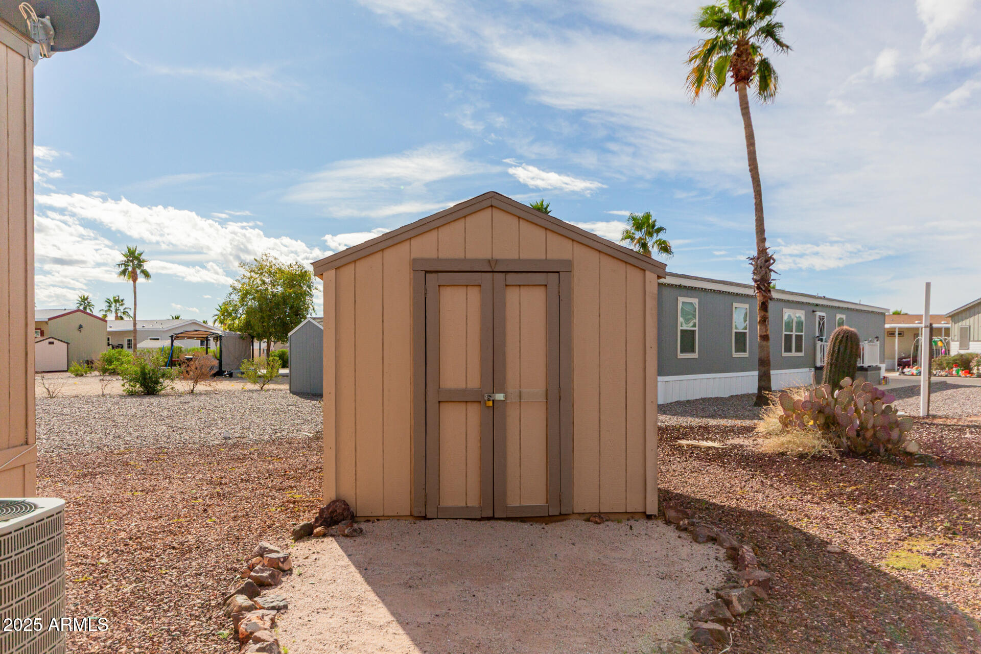 2000 South Apache Road, Unit 395 Buckeye, AZ 85326 - Photo 25 of 36 a front view of a house with a yard