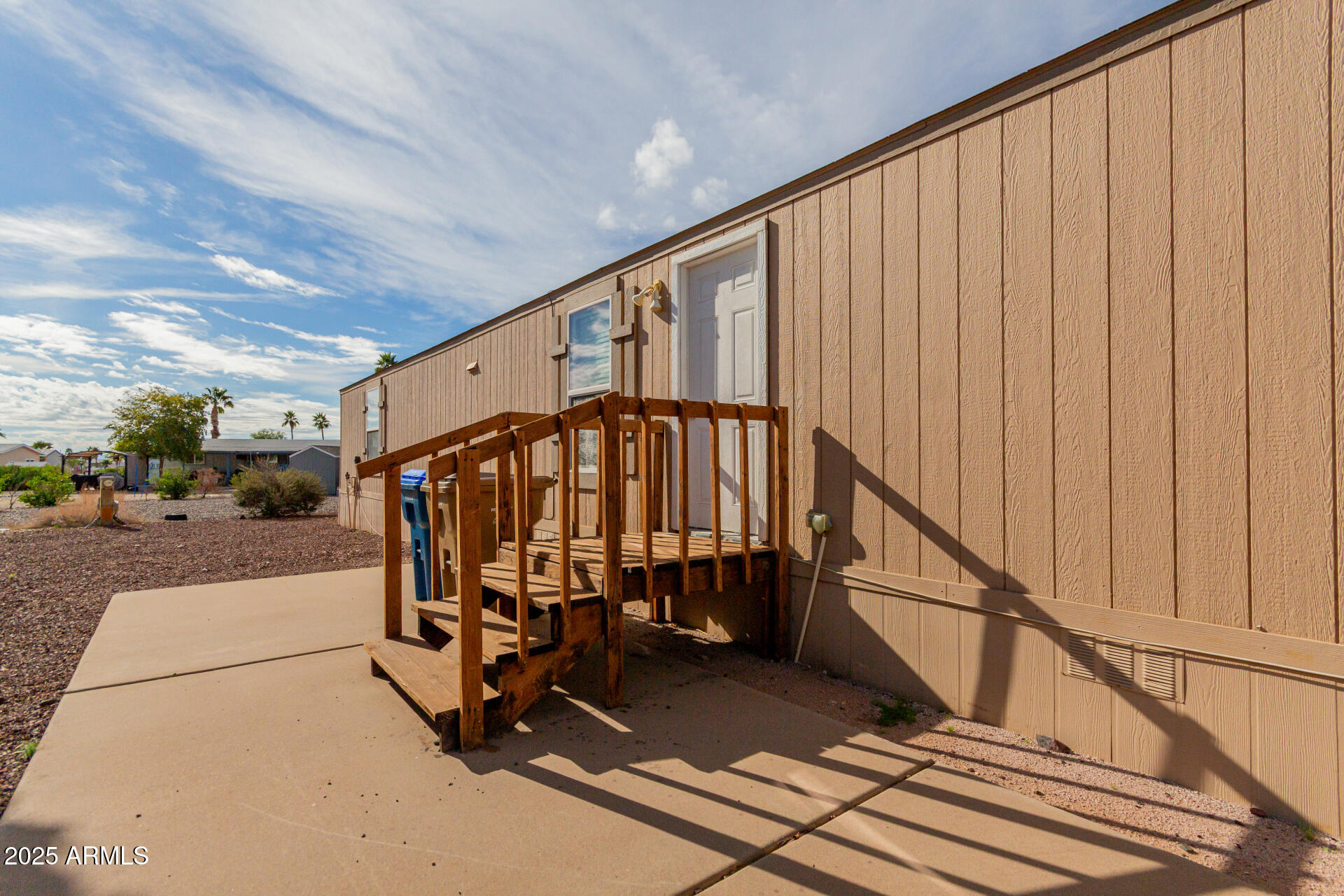 2000 South Apache Road, Unit 395 Buckeye, AZ 85326 - Photo 26 of 36 a view of entryway with a wooden floor and a potted plant
