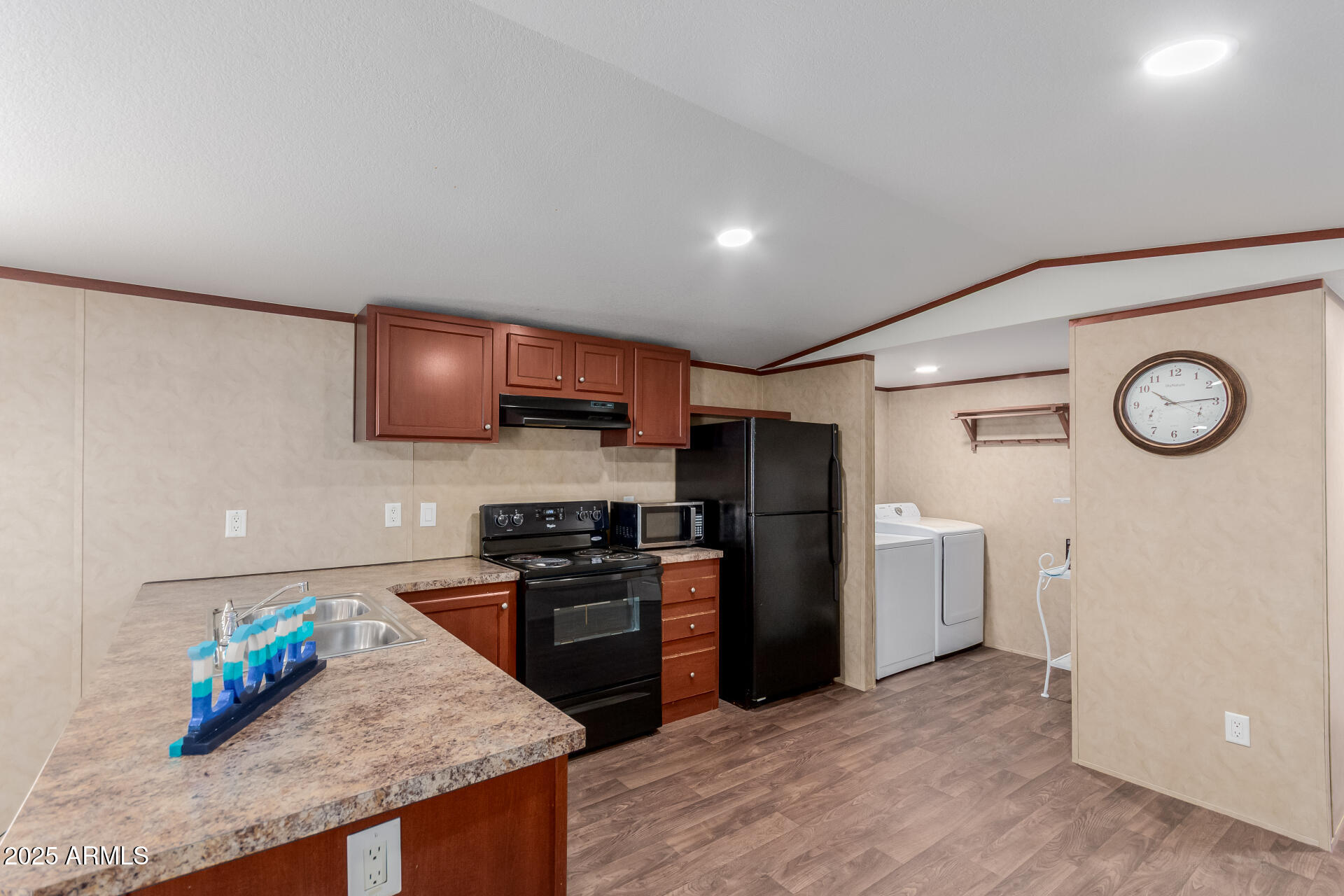 2000 South Apache Road, Unit 395 Buckeye, AZ 85326 - Photo 9 of 36 a kitchen with stainless steel appliances granite countertop a refrigerator and a stove top oven