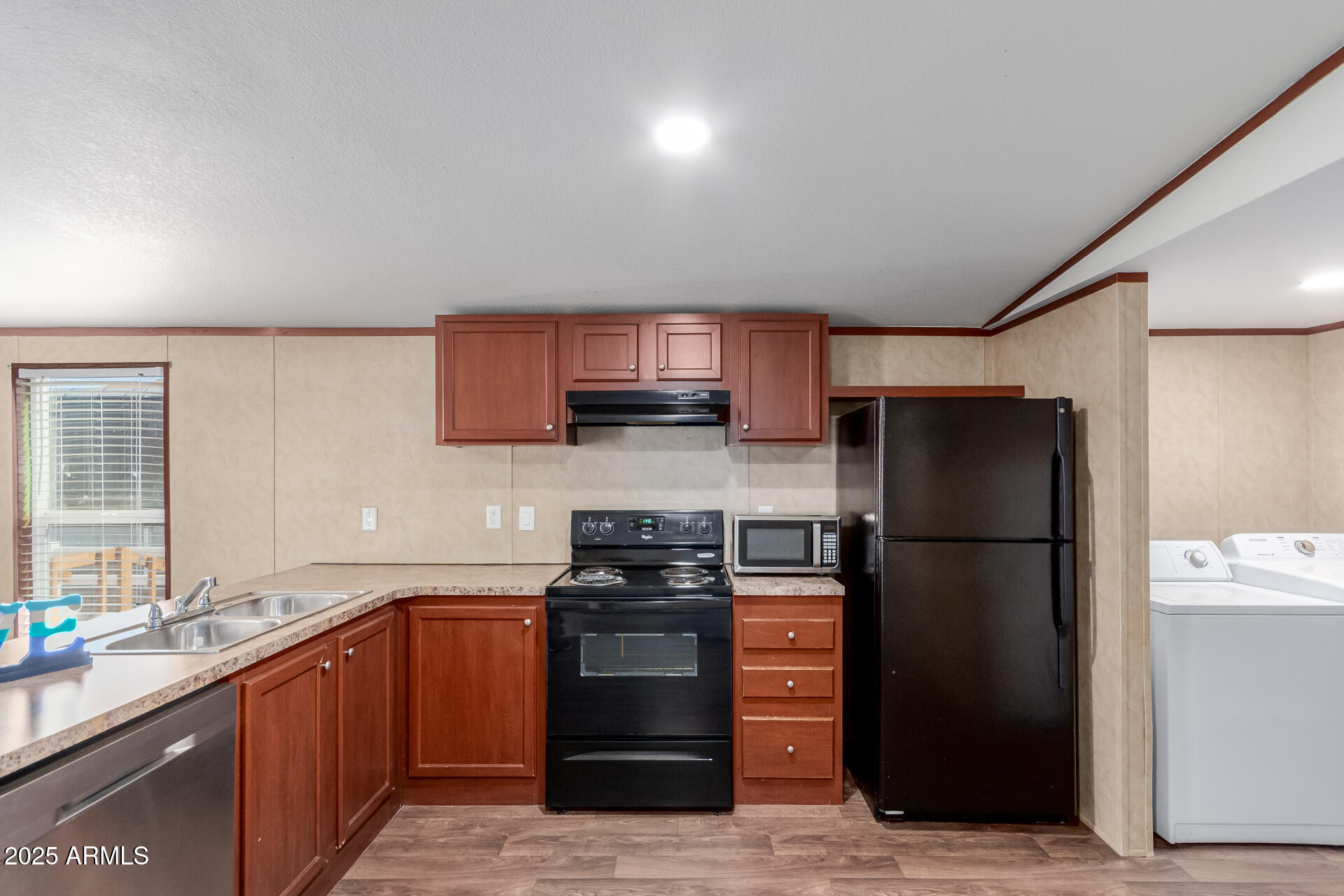2000 South Apache Road, Unit 395 Buckeye, AZ 85326 - Photo 10 of 36 a kitchen with a refrigerator stove and sink
