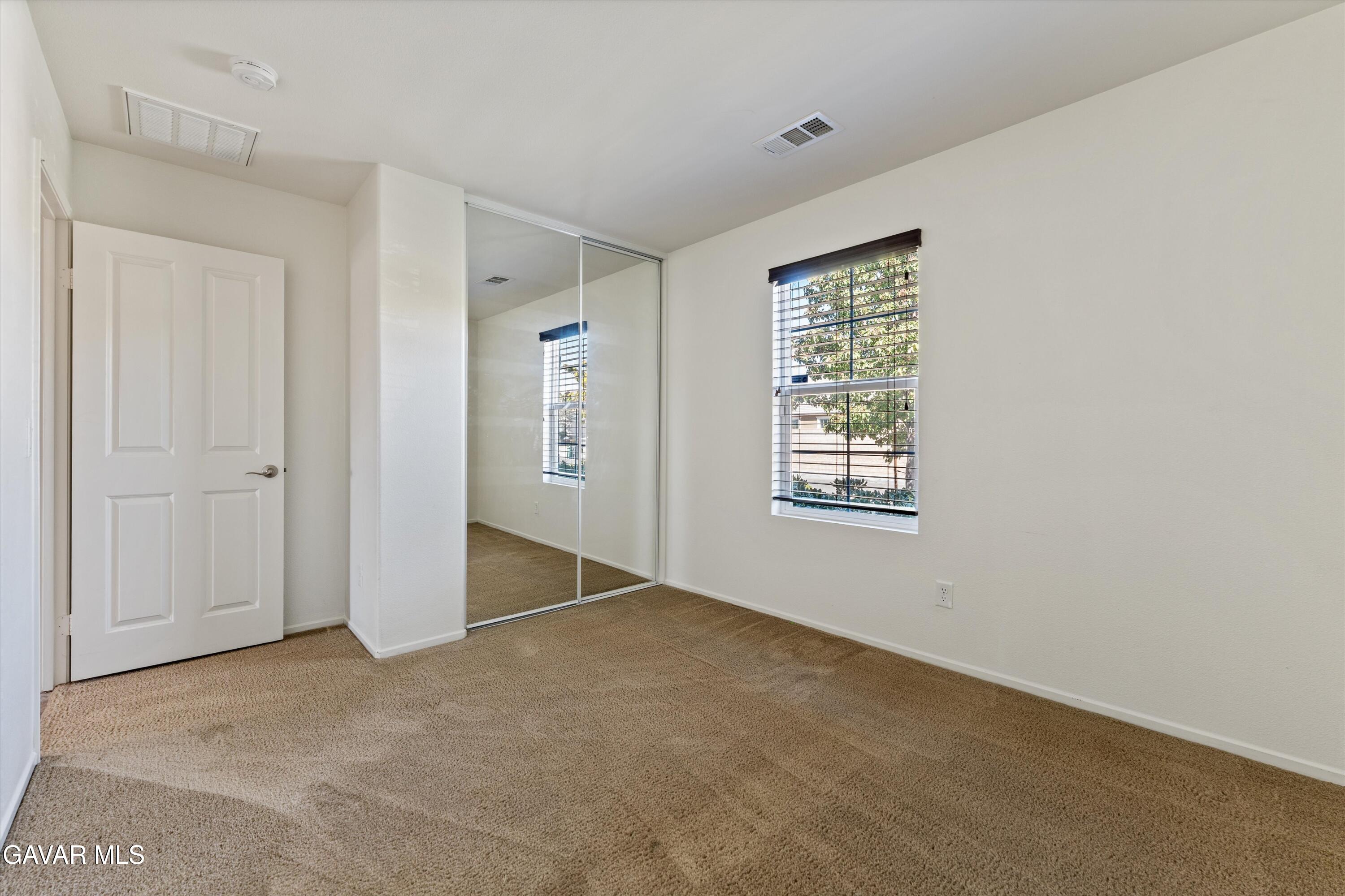 1754 West Milling Street Lancaster, CA 93534 - Photo 11 of 24 a view of an empty room with a window