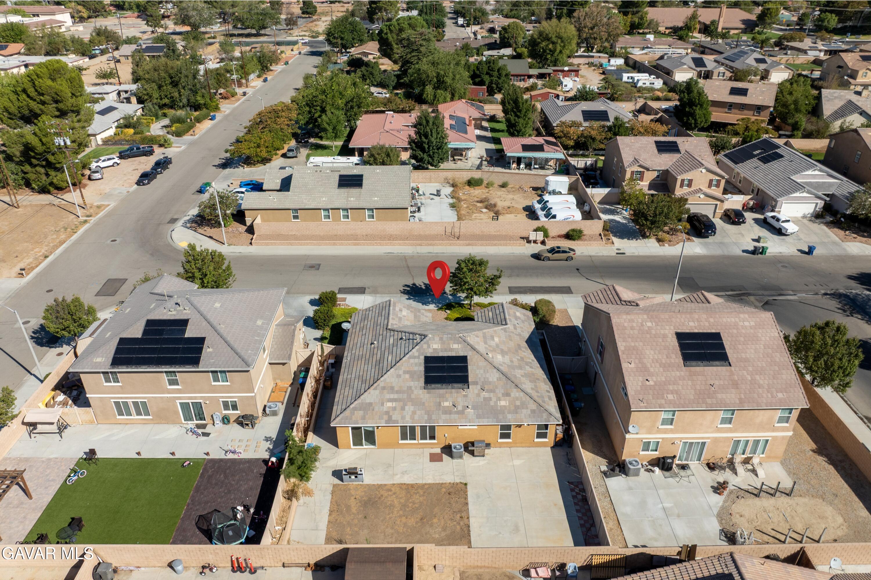 1754 West Milling Street Lancaster, CA 93534 - Photo 19 of 24 an aerial view of residential houses with outdoor space