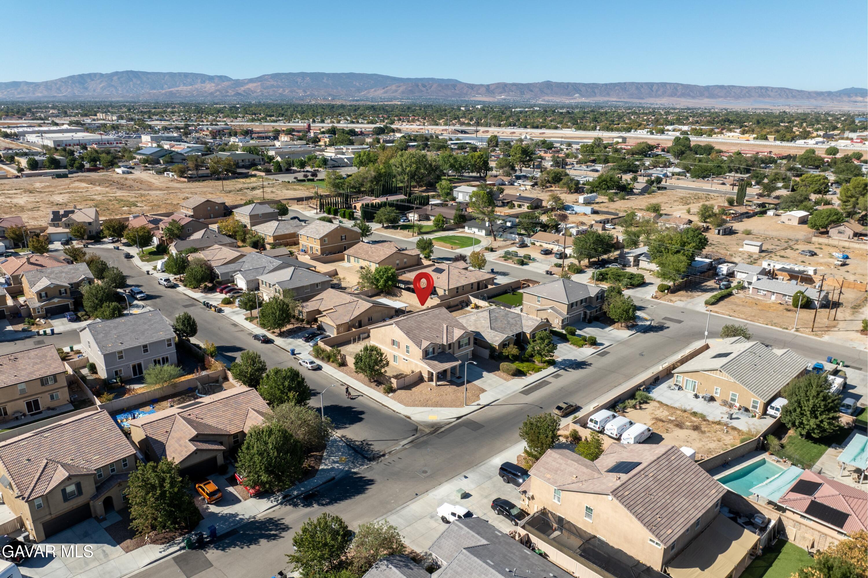 1754 West Milling Street Lancaster, CA 93534 - Photo 21 of 24 an aerial view of residential houses with outdoor space