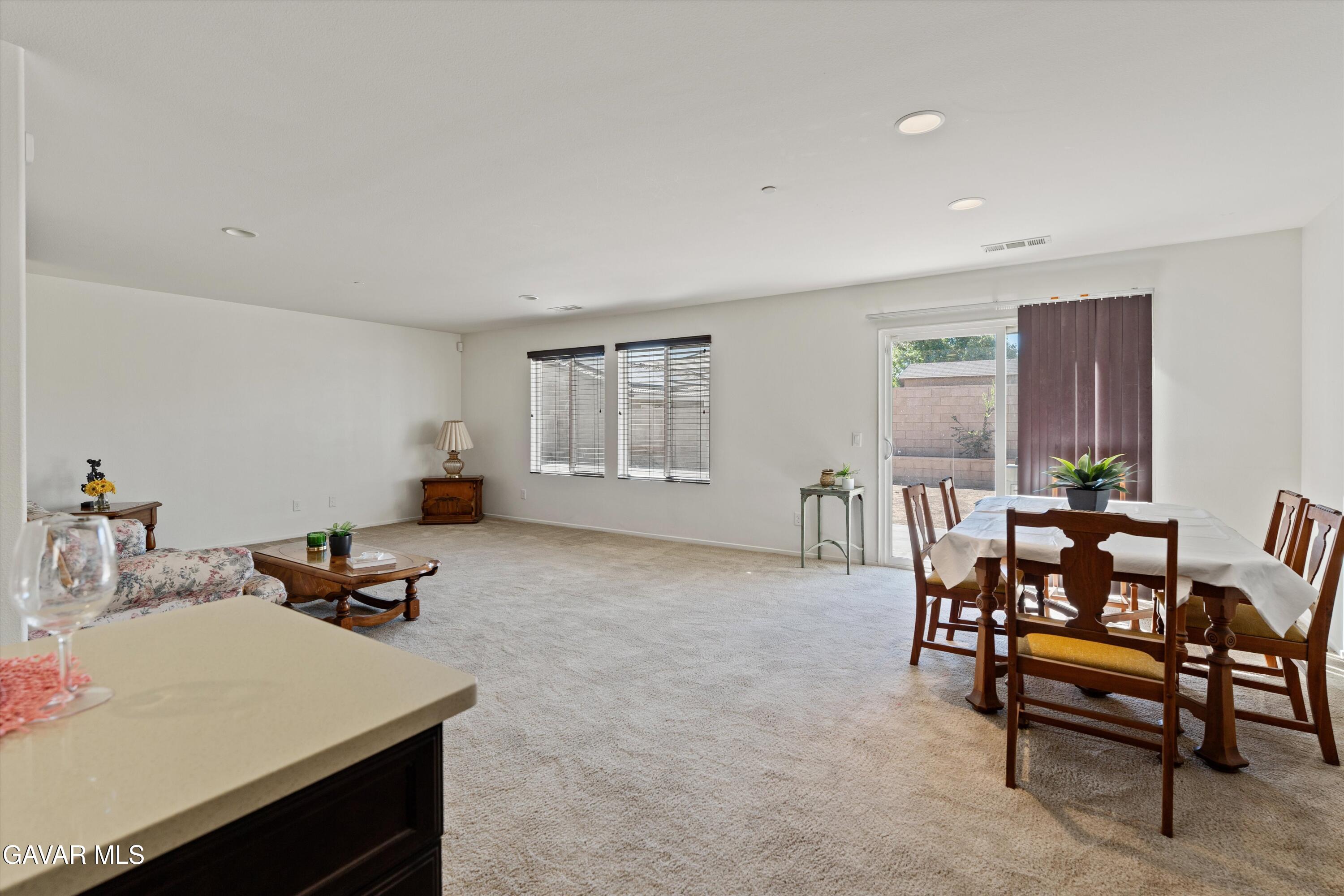 1754 West Milling Street Lancaster, CA 93534 - Photo 4 of 24 a living room with furniture and a window