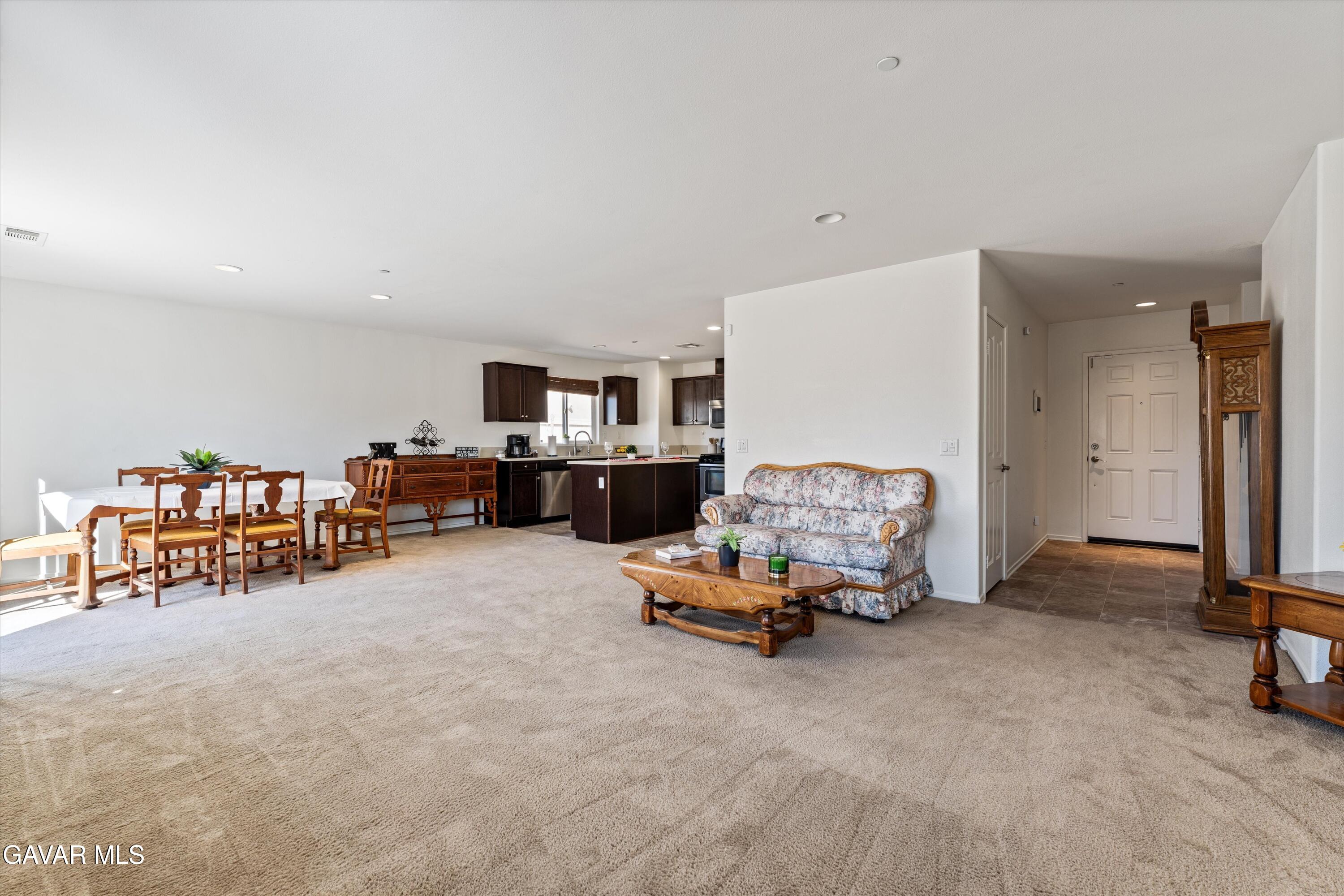 1754 West Milling Street Lancaster, CA 93534 - Photo 5 of 24 a living room with furniture and a table
