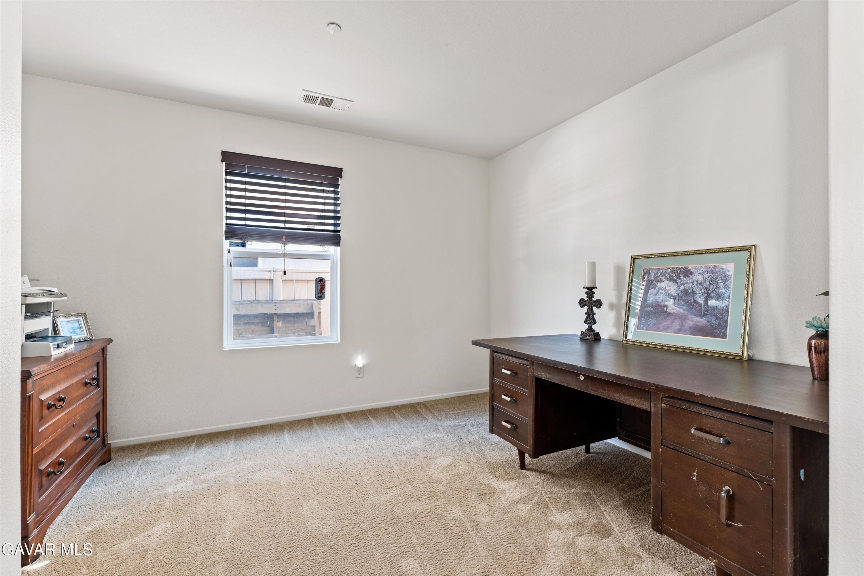 1754 West Milling Street Lancaster, CA 93534 - Photo 7 of 24 a view of workspace with furniture and window