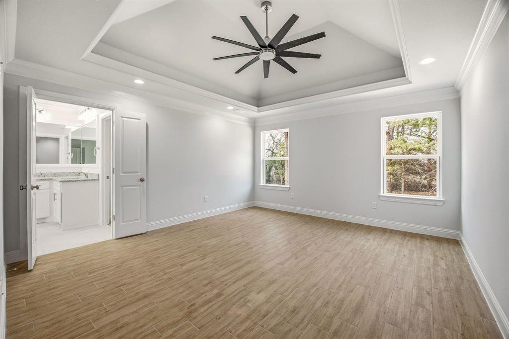 2017 Forest Bridge Azle, TX 76020 - Photo 14 of 30 Spare room with ceiling fan, light wood-style flooring, recessed lighting, plenty of natural light, and crown molding