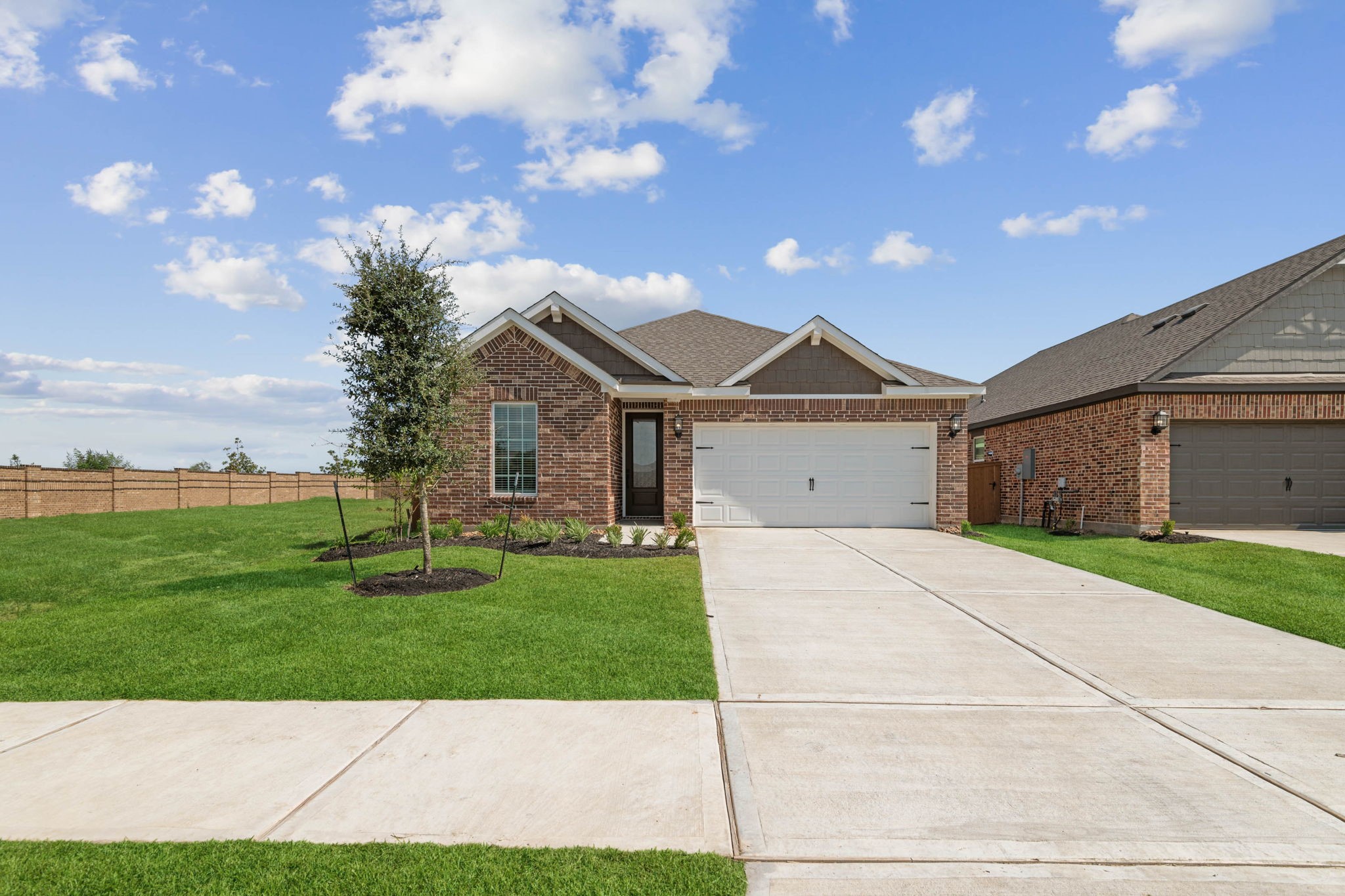 1027 Rosewood Trail Beasley, TX 77417 - Photo 1 of 22 a front view of a house with a yard and garage