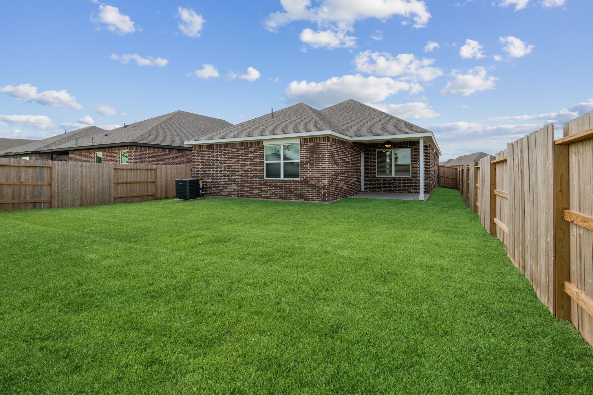 1027 Rosewood Trail Beasley, TX 77417 - Photo 2 of 22 a front view of a house with yard and green space
