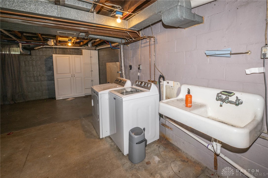 190 Swailes Road Troy, OH 45373 - Photo 37 of 82 Functional basement laundry area, ready for utility tasks.