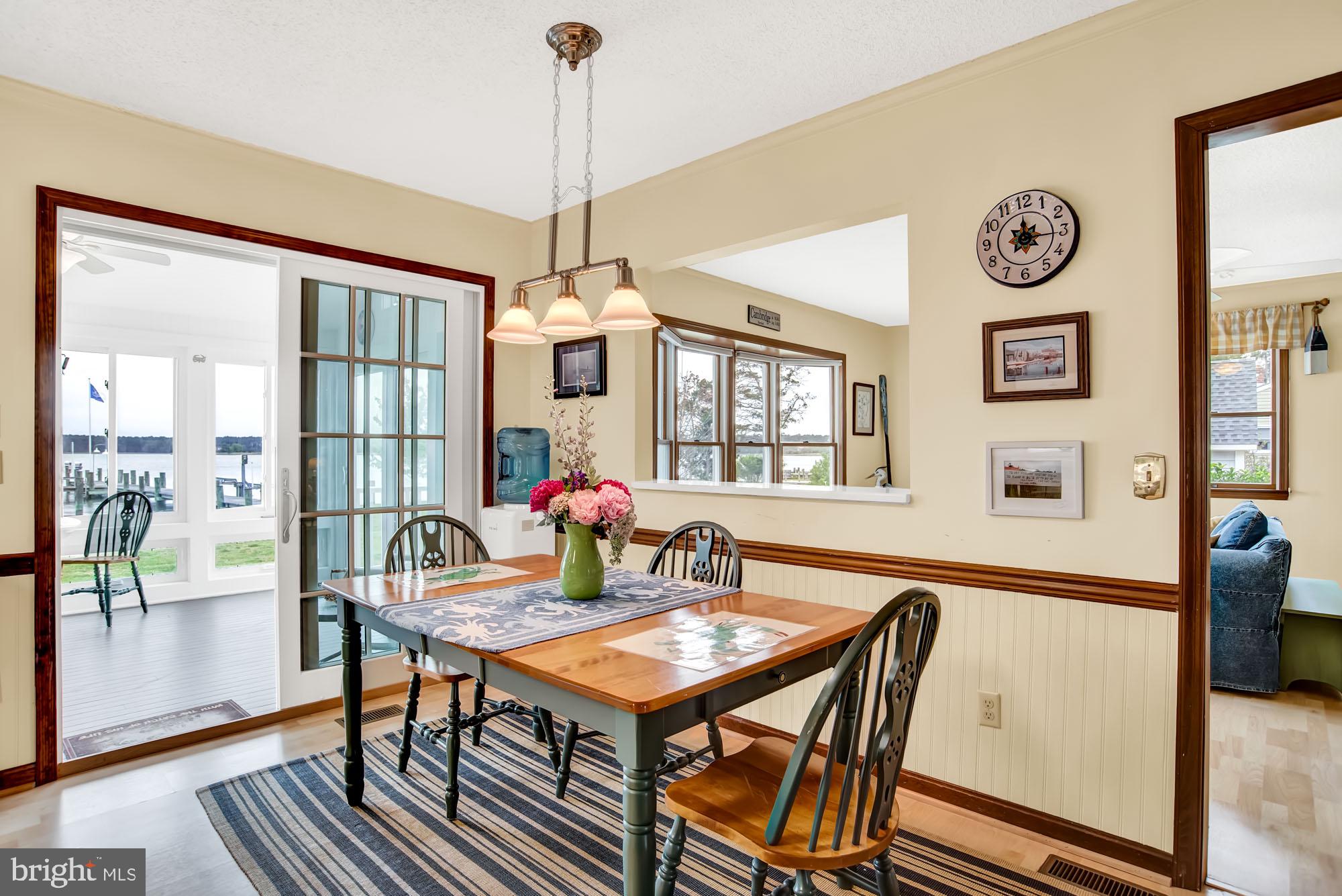 809 Seabreeze Road Cambridge, MD 21613 - Photo 21 of 75 Large dining area leads to Sun porch