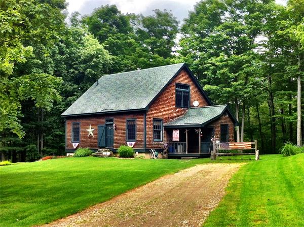 a front view of a house with a yard