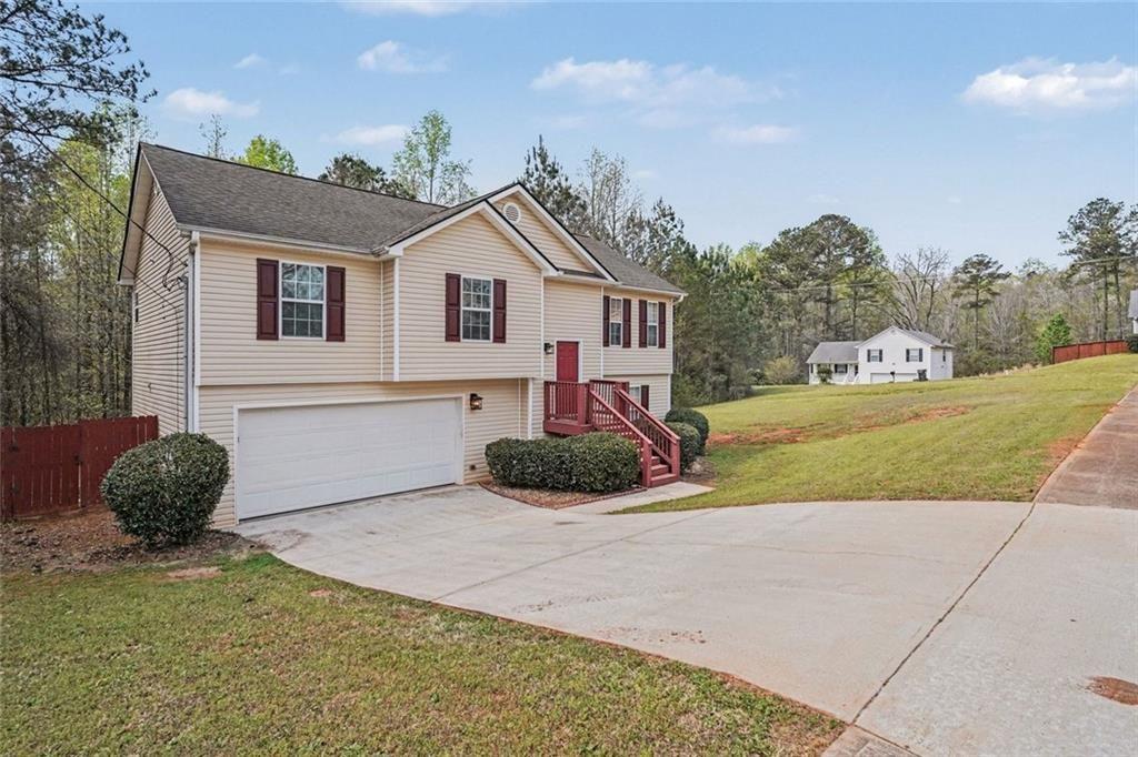 10 Wilbur Way Covington, GA 30016 - Photo 2 of 22 a front view of a house with garden