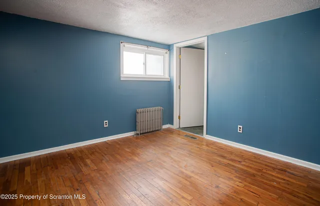 a room with a door open to a room