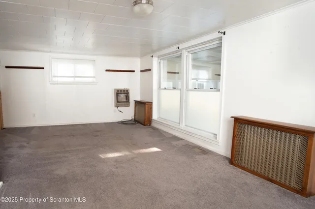 a view of empty room with windows