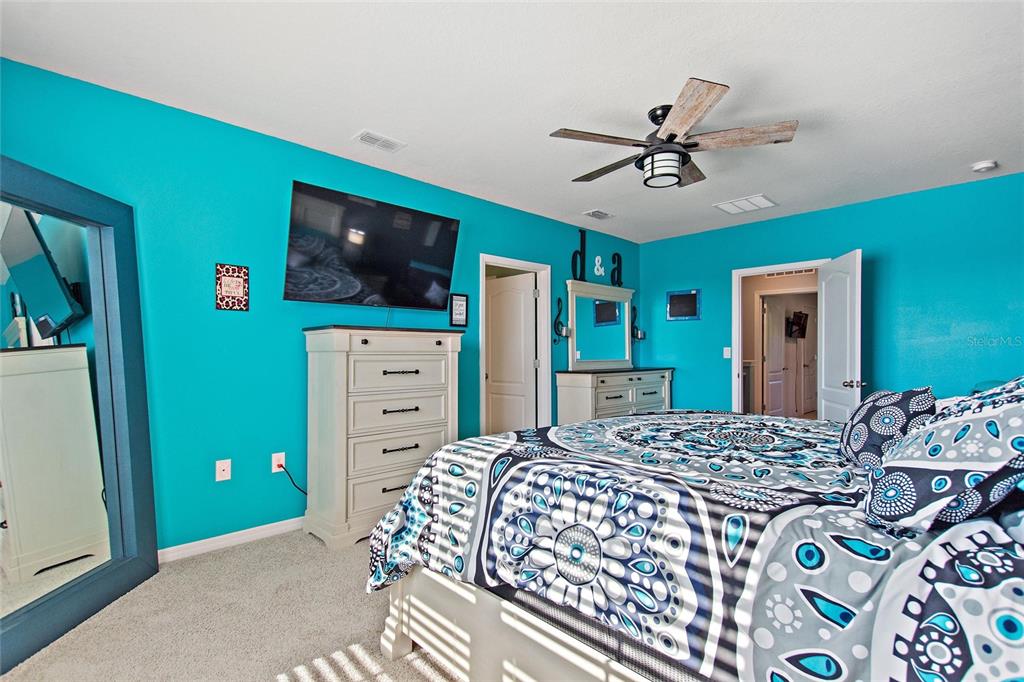856 Sun Burst Road Winter Haven, FL 33880 - Photo 18 of 54 a bedroom with a bed and a flat screen tv