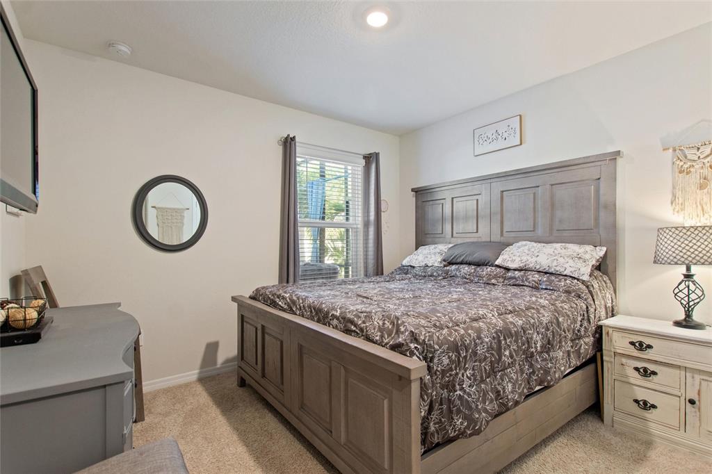 856 Sun Burst Road Winter Haven, FL 33880 - Photo 20 of 54 a bedroom with a bed and a dresser