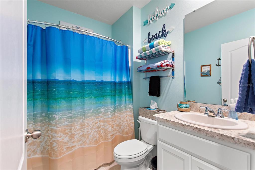 856 Sun Burst Road Winter Haven, FL 33880 - Photo 24 of 54 a bathroom with a sink toilet and shower
