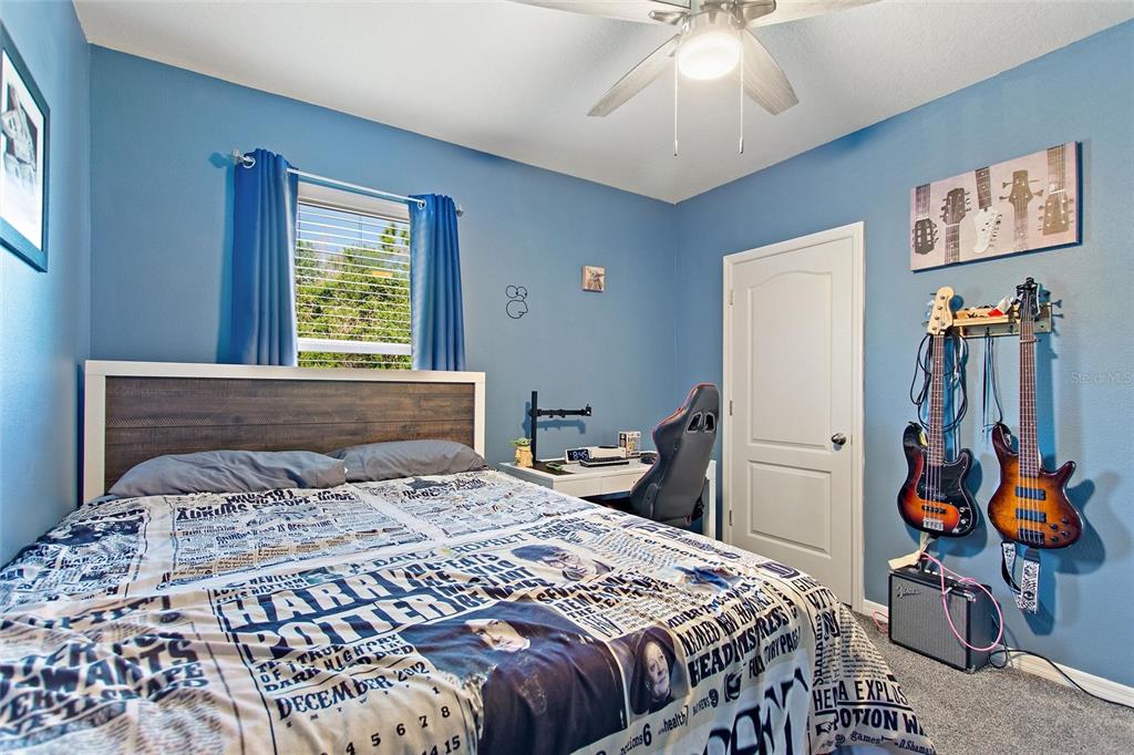 856 Sun Burst Road Winter Haven, FL 33880 - Photo 27 of 54 a bedroom with a bed and a chandelier