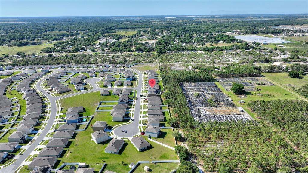 856 Sun Burst Road Winter Haven, FL 33880 - Photo 49 of 54 an aerial view of residential houses with outdoor space