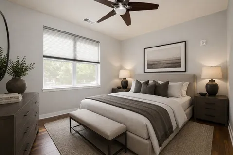 a bedroom with bed and a window