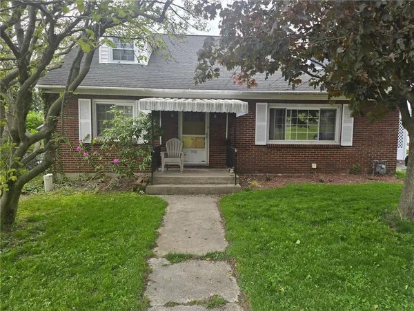 front view of a house with a yard
