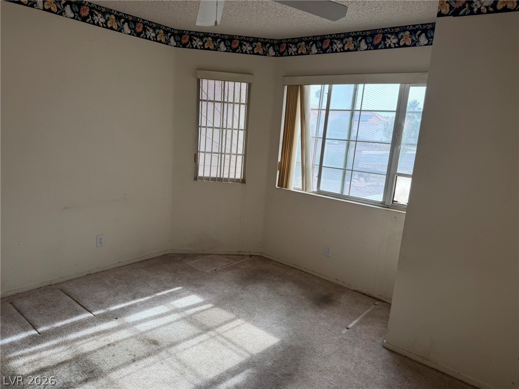277 Gentle Bay Avenue Henderson, NV 89074 - Photo 34 of 43 This spacious bedroom offers ample natural light through its generous window.