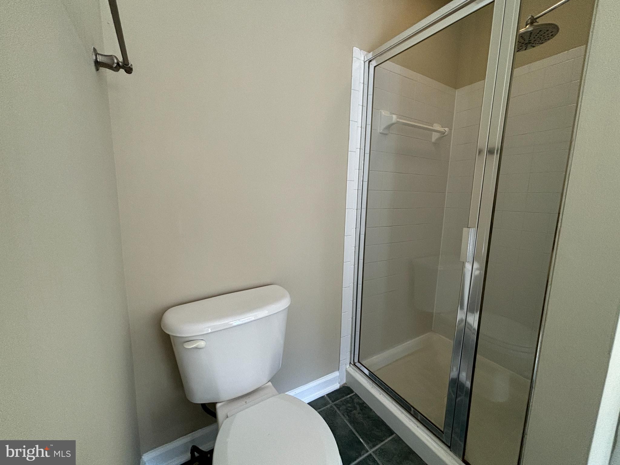 15656 Avocet Loop Woodbridge, VA 22191 - Photo 17 of 28 a bathroom with a toilet and a shower