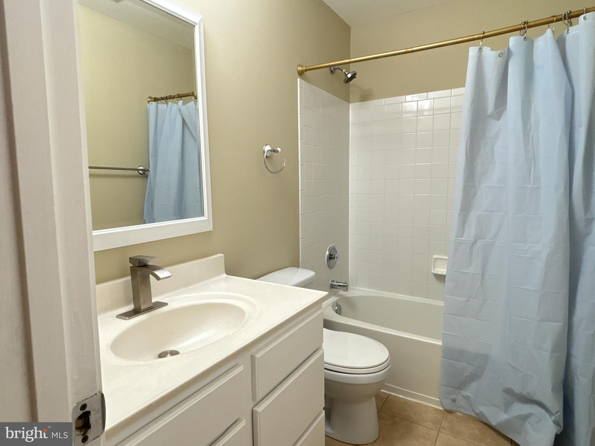 15656 Avocet Loop Woodbridge, VA 22191 - Photo 23 of 28 a bathroom with a sink a toilet and shower