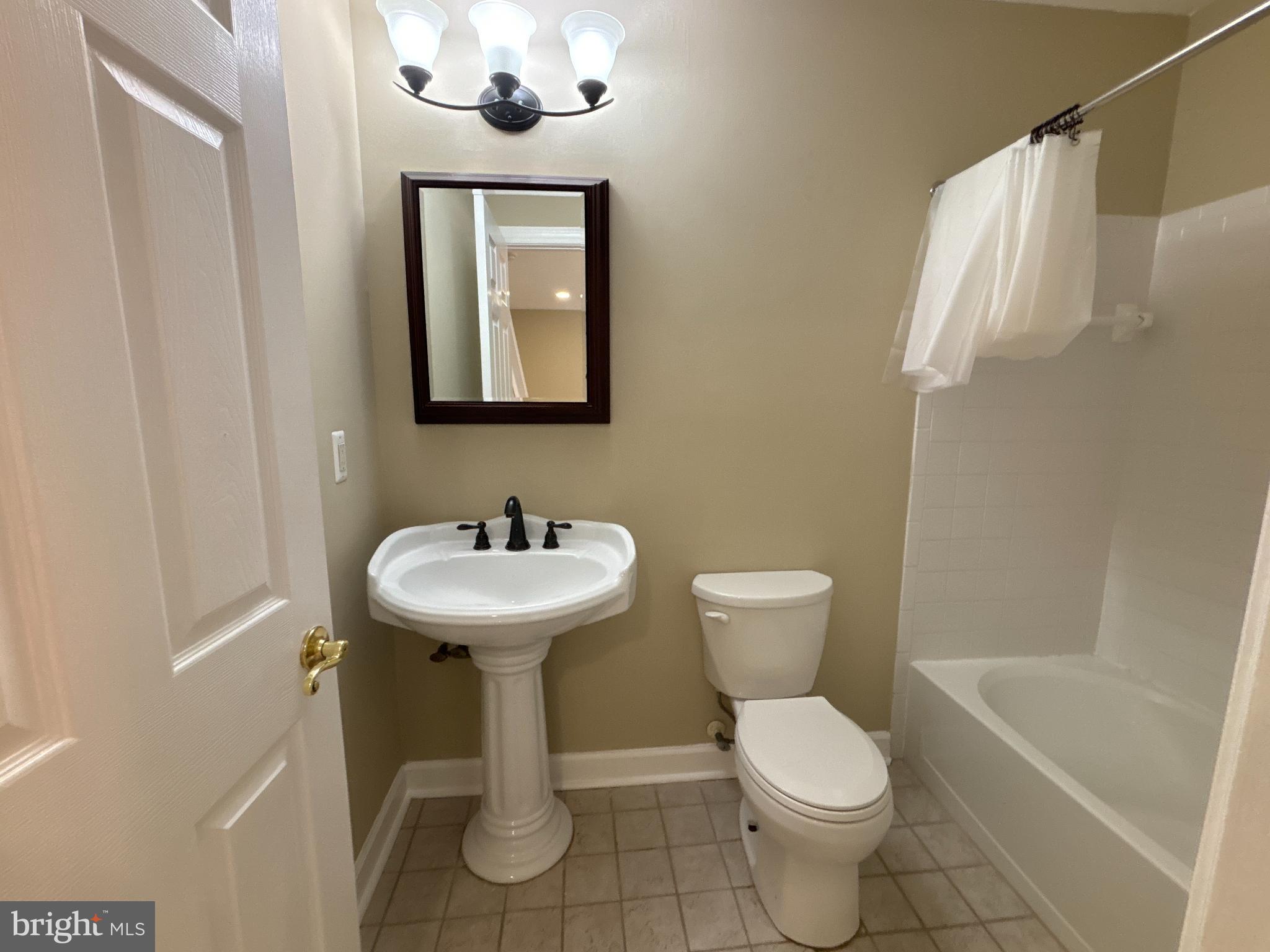 15656 Avocet Loop Woodbridge, VA 22191 - Photo 25 of 28 a bathroom with a sink toilet and shower
