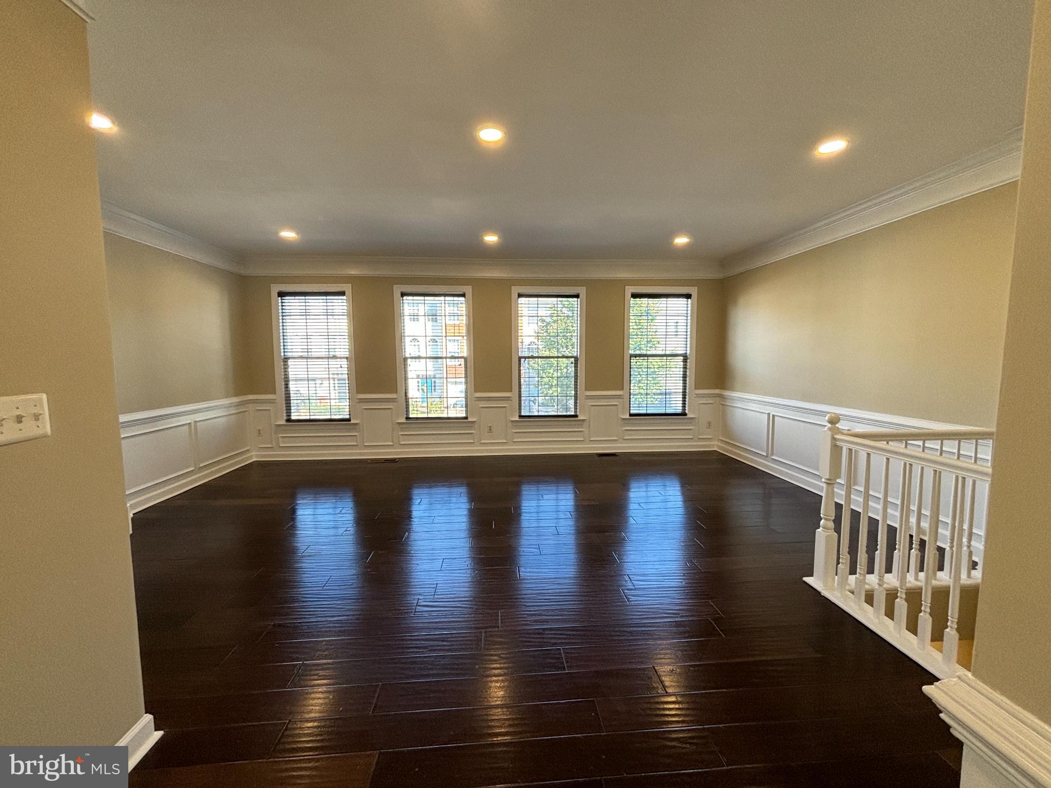 15656 Avocet Loop Woodbridge, VA 22191 - Photo 4 of 28 a view of an empty room with wooden floor and a window