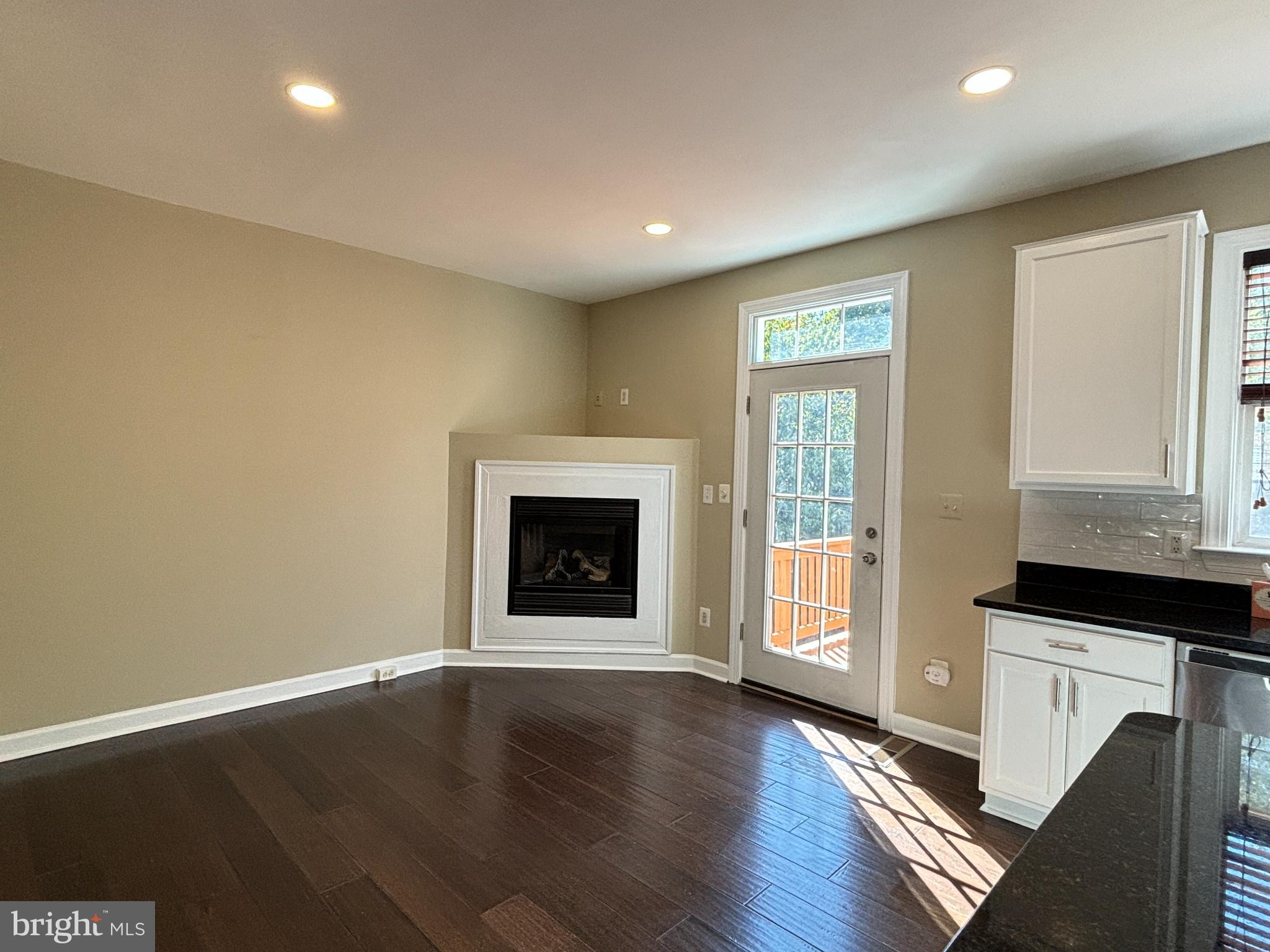 15656 Avocet Loop Woodbridge, VA 22191 - Photo 8 of 28 a view of an empty room with wooden floor and a window