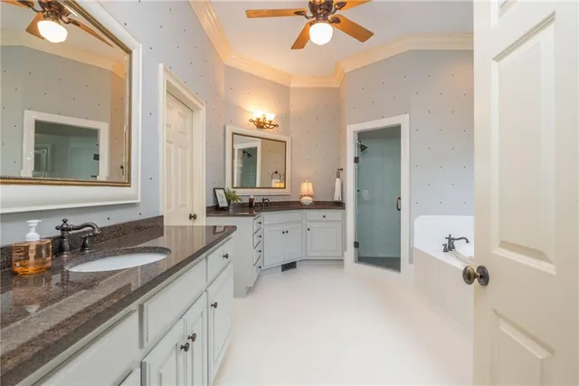 a utility room with sink dryer and washer