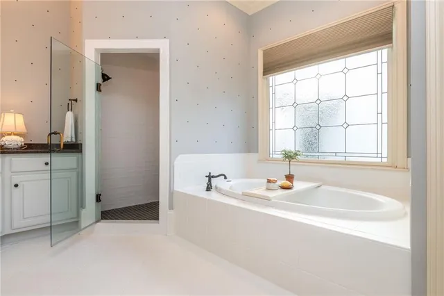 a dining room with furniture wooden floor a rug and a chandelier