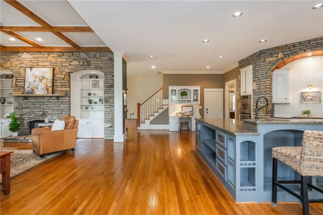 a bathroom with a sink vanity granite and a mirror