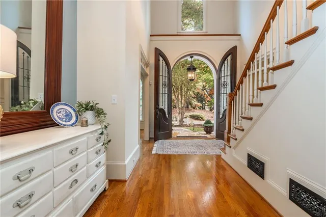 a view of a a dining room with furniture window and wooden floor