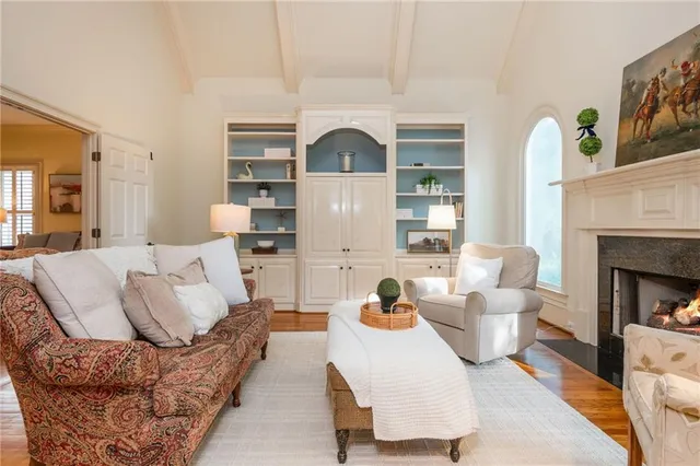 a view of living room with furniture and floor to ceiling windows