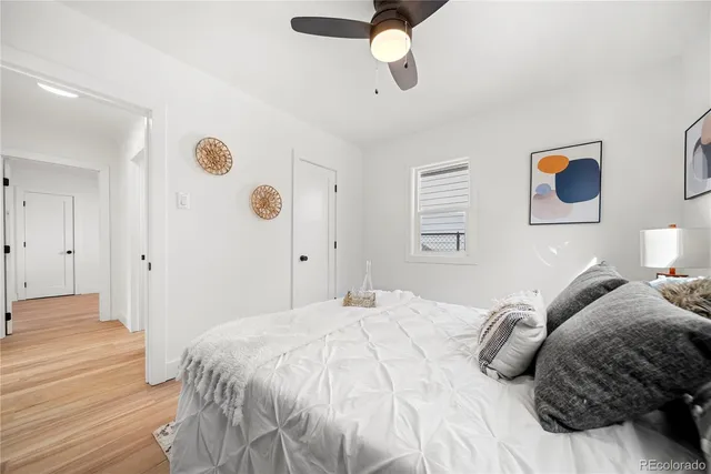 a bedroom with a bed and cabinets