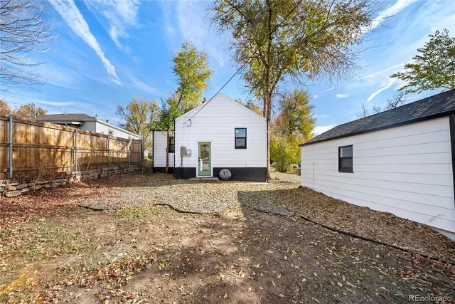 a house with a tree in the background