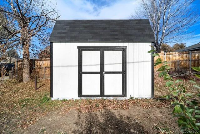 a view of road with card parked on side and road