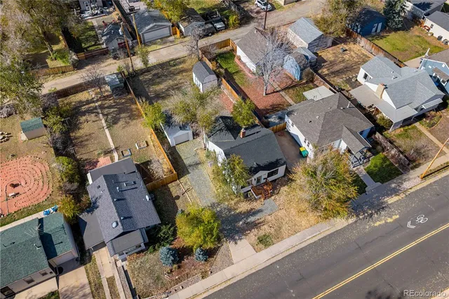 an aerial view of a houses with yard
