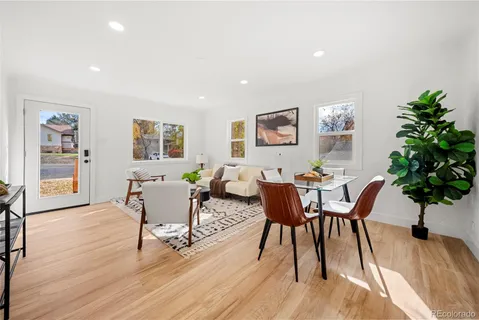 a view of a dining room with furniture and wooden floor