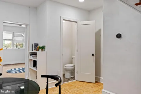 a bathroom with a toilet a sink and a shower
